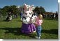 Enjoying the sunny day, a young visitor at the White House Easter Egg Roll meets one of the Easter bunnies on the South Lawn, Monday, April 1, 2002. White House photo by Evan Parker.