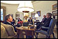 President George W. Bush meets with New York Governor George Pataki, right, and Mayor Michael Bloomberg in the Oval Office Monday, April 1. During their meeting, the president announced that New York's Governors Island will be transferred from federal to local state government. White House photo by Tina Hager.