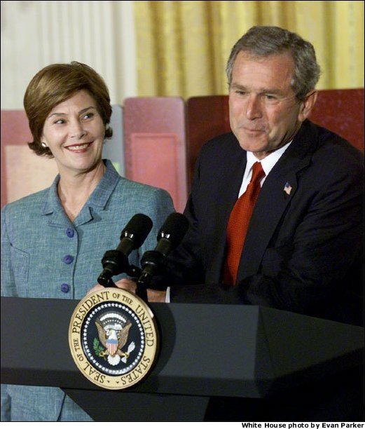 President George W. Bush and Laura Bush discuss the importance of involving families and teachers to help children read at an early age in the East Room Wednesday, April 3. Promoting the Early Childhood Education Initiative, Mrs. Bush is the honorary national chairperson of the PBS Designated Reader campaign. After their remarks, the audience of adults and children were visited by Mister Rogers and Elmo from Sesame Street. White House photo by Evan Parker.