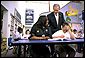 President George W. Bush talks with students at the South End Community Center in Bridgeport, Conn., Tuesday, April, 9. Americorps volunteers come to the community center to mentor students. "We need to encourage programs to expand, to give people an outlet, a chance to participate," said the President during his remarks at the city's Klein Auditorium where he oulined how people could join the ranks of thousands who are already serving in one America's Freedom Corps groups. White House photo by Tina Hager.