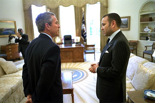 President George W. Bush talks with His Majesty King Mohammed VI of Morocco in the Oval Office Tuesday, April 23. "Today, I've informed His Majesty that our government will work to enact a free trade agreement with Morocco," said the President to the media. "Trade is an important part of good foreign policy, it's an important part of making sure Americans can find jobs." White House photo by Eric Draper.