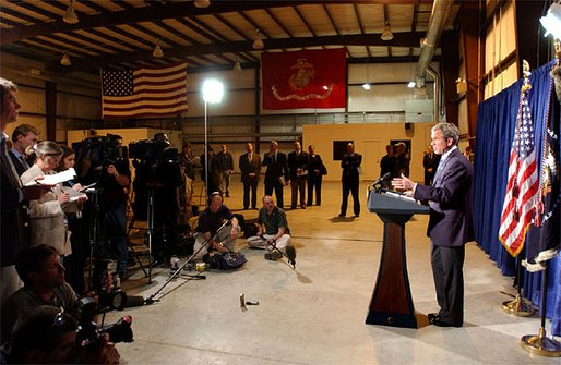 President George W. Bush delivers remarks to the press inside the Marine One hangar at the Bush Ranch in Crawford, Texas following his meeting with the Crown Prince of Saudi Arabia, Thursday, April 25, 2002. WHITE HOUSE PHOTO BY TINA HAGER.