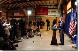 President George W. Bush delivers remarks to the press inside the Marine One hangar at the Bush Ranch in Crawford, Texas following his meeting with the Crown Prince of Saudi Arabia, Thursday, April 25, 2002. White House photo by Tina Hager.