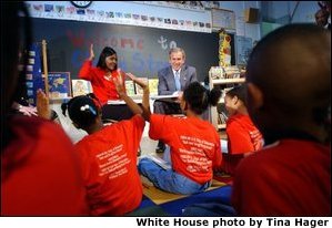 President George W. Bush visits with teacher Carolyn Davis and her students at Clarke Street Elementary School in Milwaukee, Wis., Wednesday, May 8. "I'm here because this is a great school that believes every child can learn," said President Bush who listened to the students demonstrate their reading drills. During his talk with the children, the President emphasized the importance of reading over watching television. None