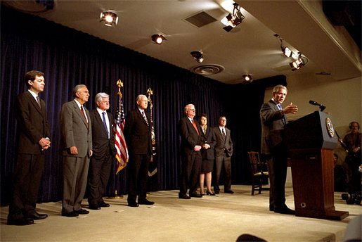 President George W. Bush speaks before signing the Enhanced Border Security and Visa Entry Reform Act in the Presidential Hall in the Dwight D. Eisenhower Executive Office Building May, 14. Pictured with the President, from left to right, are: Sen. Sam Brownback of Kan., Rep. George Gekas of Penn., Sen. Edward Kennedy of Mass., Sen. Orrin Hatch of Utah, Rep. James Sensenbrenner of Wis., Sen. Dianne Feinstein of Calif., and Sen. John Kyl of Ariz. White House photo by Paul Morse.