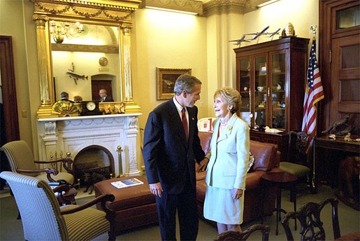 President George W. Bush talks privately with former First Lady Nancy Reagan before attending a ceremony in which Congress awarded her and former President Ronald Reagan with the Congressional Gold Medal at the United States Capitol Thursday, May 16. "At every step of an amazing life, Nancy Reagan has been at Ronald Reagan's side," said the President in his remarks. "Right by his side. As his optimism inspired us, her love and devotion strengthened him." White House photo by Tina Hager.