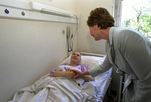 Laura Bush visits a patient in an oncology clinic in Budapest, Hungary, May 17, 2002. White House photo by Susan Sterner