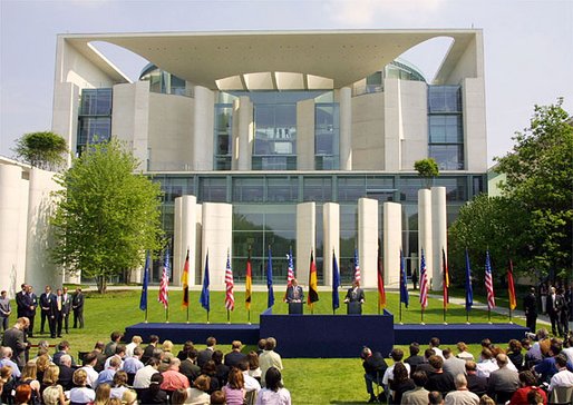 President George W. Bush answers questions during a press conference with German Chancellor Gerhard Schroeder in the courtyard of the Kanzleramt-Chancellery Building in Berlin, Germany, Thursday, May 23. White House photo by Paul Morse.