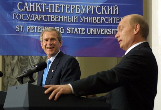 President George W. Bush laughs at a comment by Russian President Vladimir Putin during a question and answer session with students at St. Petersburg State University in St Petersburg, Russia on May 25, 2002. White House photo by Paul Morse.