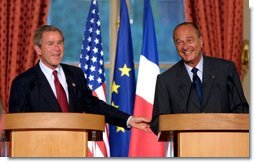 President George W. Bush answers questions at a press conference with French President Jacques Chirac at the Elysee Palace in Paris, France on May 26, 2002. White House photo by Paul Morse.