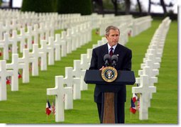 President George W. Bush gives a Memorial Day at the Normandy American Cemetery at Normandy Beach in France on May 27, 2002. White House photo by Paul Morse.