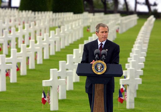 President George W. Bush gives a Memorial Day at the Normandy American Cemetery at Normandy Beach in France on May 27, 2002. 