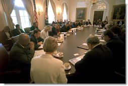 President George W. Bush prays with his Cabinet at the beginning of their meeting May 30. "This a day in which we've removed all the debris from Ground Zero. On behalf of a grateful nation, I want to thank all those who participated in the clean up of that deadly site; and want our nation to continue to offer our prayer to those families and friends and citizens who still hurt as a result of the attacks of September the 11th." White House photo by Eric Draper.