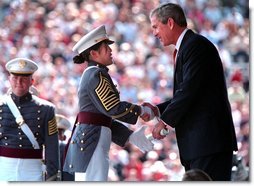 President Bush presents a diploma to a United States Military Academy graduate at West Point, N.Y. Saturday, June 1. White House photo by Paul Morse.