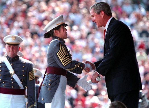 President Bush presents a diploma to a United States Military Academy graduate at West Point, N.Y. Saturday, June 1. 