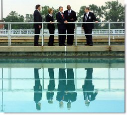 President George W. Bush tours the Kansas City Water treatment plant Tuesday, June 11. He is accompanied by Tom Ridge, Director of the Homeland Security Council, far right; Christie Todd Whitman, Administrator of the Environmental Protection Agency, center right; Mr. Gurnie Gunter, Director Of Water and Pollution Control for the city of Kansas City, Mo., center left; and John Reddy, Director Of Water Treatment Services. White House photo by Paul Morse.