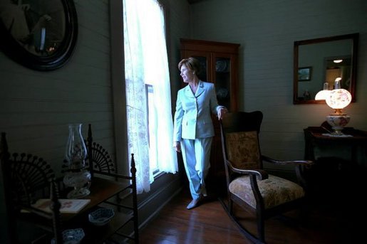 Laura Bush walks through the home of author Katherine Anne Porter in Kyle, Texas, June 13, 2002. White House photo by Tina Hager
