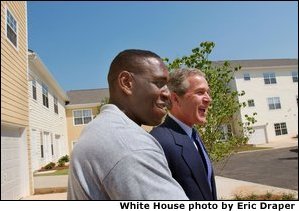 President George W. Bush and new home owner Al Smith tour Pryor Road Corridor Development in Atlanta, Georgia, Monday, June 17. 