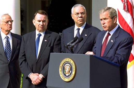 President George W. Bush announces a new Mother and Child HIV Prevention Initiative in the Rose Garden June 19. Standing by the President from, left to right, are Secretary of Treasury Paul O'Neill, Secretary of Health and Human Services Tommy Thompson and Secretary of State Colin Powell. 