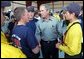 President George W. Bush greets members of the fire deparment in Show Low, Ariz., during his visit to the forest fire area in Springerville, Ariz., Tuesday, June 24. 