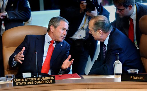 President George W. Bush talks with French President Jacques Chirac at the start of the G8 leaders' working session in Kananaskis, Canada, Thursday, June 27. 