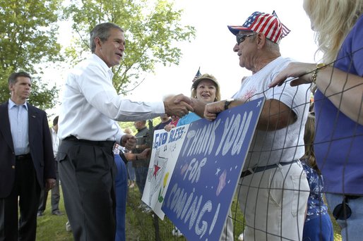 President George W. Bush greets residents of Ripley, West Virginia moments after his arrival on Marine One, July 4, 2002. Watch webcast of Fireworks on the National Mall. White House photo by Eric Draper.