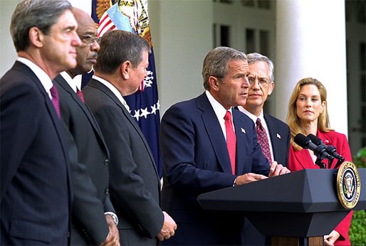 President George W. Bush announces the White House conference on Missing, Exploited and Runaway children in the Rose Garden Aug. 6. Standing with him are, from left to right, FBI Director Robert Mueller, Education Secretary Rod Paige, Attorney General John Ashcroft, and Ernie Allen and Carolyn Atwell-Davis from The National Center for Missing and Exploited Children. White House photo by Tina Hager.