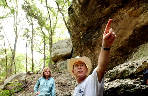 President George W. Bush tours a canyon with White House Staff Secretary Harriet Miers at his ranch in Crawford, Texas, Friday, Aug. 9, 2002. White House photo by Eric Draper.