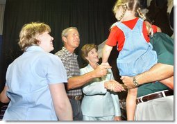 President George W. Bush and Mrs. Bush greet Crawford volunteers and their families during a luncheon to thank volunteers who have helped with events in the Crawford area, Friday, Aug. 16, 2002 in Crawford, Texas. White House photo by Eric Draper.