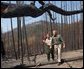 President George W. Bush tours the Squires Peak Fire Area in Medford, Ore., with Ron Wenker of the Medford Bureau of Land Management Properties District, Thursday, Aug. 22, 2002.  
