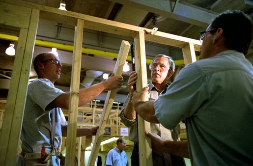 President Bush pitches in on a construction project during a tour of the Carpenters Joint Apprenticeship Center in Pittsburgh, Pa. The President’s Council of Economic Advisers, CEA, estimates the Jobs and Growth plan will create 1.4 million new jobs by the end of 2004, with 510,000 jobs created in 2003 and another 891,000 jobs created in 2004. White House photo by Paul Morse.