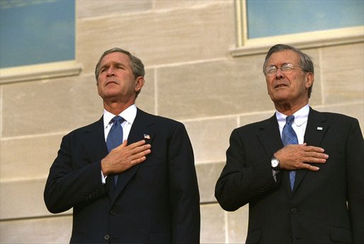 Attending the Pentagon Observance ceremony, President George W. Bush and Secretary of Defense Donald Rumsfeld say the Pledge of Allegiance before speaking Tuesday, Sept. 11. White House photo by Eric Draper.