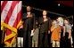 President George W. Bush pledges allegiance to the flag with Secretary of Education Rod Paige at a Pledge Across America event at East Literate Magnet School in Nashville, Tennessee on Tuesday, Sept. 17, 2002.  