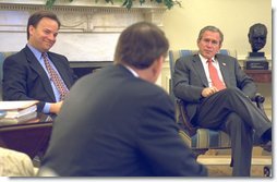 President George W. Bush and Dr. Mark McClellan (left) listen to Tommy Thompson, Secretary of Health and Human Services, during a meeting in the Oval Office Wednesday, September 25, 2002. During the meeting President Bush announced Dr. McClellan, as nominee to be Commissioner of the Food and Drug Administration. Dr. McClellan is currently a member of the President's Council on Economic Advisors, and he also serves as a senior policy director for health care and related economic issues for the White House. White House photo by Tina Hager.