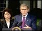 President Bush, joined by Secretary of Labor Elaine Chao Tuesday, discussed West Coast ports outside the Oval Office. Video screen capture by Monty Haymes.