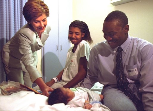 Laura Bush visits with parents Ronnie and Chakeiva Collins, a couple from Plant City, Fla. and their 2-day-old son at Tampa General Hospital on Tuesday, October 1. Mrs. Bush presented the new parents a copy of the Healthy Start, Grow Smart magazine series that provides parents with critical information about the early development, health, nutrition and safety needs of babies and toddlers. White House photo by Susan Sterner