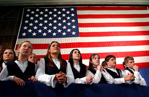Members of the Hampden Academy Chamber Choir listen to President George W. Bush during the Maine Welcome in Bangor, Maine, Tuesday, Oct. 22. White House photo by Eric Draper.