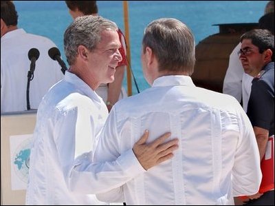 President George W. Bush walks with Russian Prime Minister Mikhail Mikhaylovich Kasyanov before the start of the Reading of the Leaders' Declaration at APEC in Los Cabos, Mexico, Sunday, Oct. 27. White House photo by Tina Hager