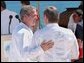 President George W. Bush walks with Russian Prime Minister Mikhail Mikhaylovich Kasyanov before the start of the Reading of the Leaders' Declaration at APEC in Los Cabos, Mexico, Sunday, Oct. 27.  