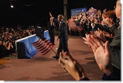 President George W. Bush acknowledges the crowd during his introduction at the Illinois Welcome at the Illinois Police Armory in Springfield, Illinois, Sunday, Nov. 3, 2002  White House photo by Eric Draper