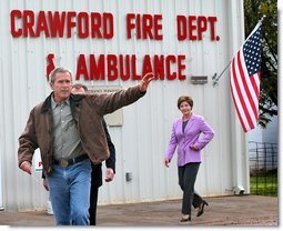 President George W. Bush and Laura Bush leave the Crawford Firehouse after voting in Crawford, Texas, Tuesday, Nov. 5.  White House photo by Eric Draper