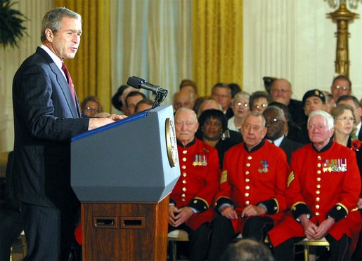 President George W. Bush makes remarks to American and British veterans ( seated in background) in the East Room of the White House on Veteran's Day, November 11, 2002 White House photo by Paul Morse.