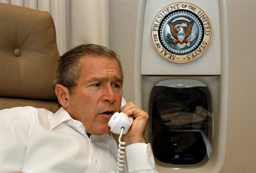 President George W. Bush calls Republican Sen. Trent Lott and assembled lawmakers about the passage of the Homeland Security legislation from his Air Force One office during his flight to Prague, The Czech Republic, Tuesday, Nov. 19, 2002. White House photo by Eric Draper