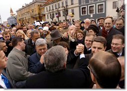 President George W. Bush greets Lithuanians in person at the Rotuse Square in the center of Vilnius, Lithuania, Nov. 23. "This is a great day in the history of Lithuania, in the history of the Baltics, in the history of NATO, and in the history of freedom," said President Bush in his remarks. "And I have the honor of sharing this message with you: We proudly invite Lithuania to join us in NATO, the great Atlantic Alliance."  White House photo by Paul Morse