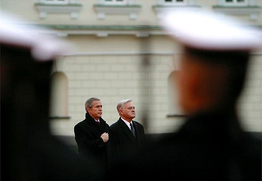 President George W. Bush and Lithuanian President Valdas Adamkus stand at attention during a welcoming ceremony at the Prezidentura, the Presidential Palace, in Vilnius, Lithuania, Nov. 23. A former Chicago-area resident and U.S. environmental regulator, President Adamkus was elected to office in 1998. White House photo by Paul Morse.