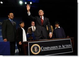 President George W. Bush waves to the audience after signing an executive order for equal protection of the laws for faith-based and community organizations in Philadelphia, Pa., Thursday, Dec. 12.  White House photo by Eric Draper
