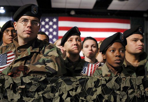 Army troops and personnel listen to President George W. Bush during his visit to Fort Hood in Killeen, Texas, Friday, Jan. 3, 2003. "Ft. Hood and the units that call it home have a special place in our country's military history, said the President. "For decades, soldiers from the First Team and the Iron Horse Division, and from other units, have fought America's battles with distinction and courage." White House photo by Eric Draper.