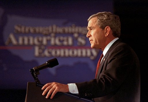 President George W. Bush addresses the Economic Club of Chicago. “As it is now, many investments are taxed not once, but twice,” said the President in his remarks. “First, the IRS taxes a company on its profit. Then it taxes the investors who receive the profits as dividends. The result of this double taxation is that for all the profit a company earns, shareholders who receive dividends keep as little as 40 cents on the dollar.” White House photo by Paul Morse