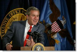 President George W. Bush talks with the employees of National Capital Flag Company in Alexandria. Va., about his Growth and Jobs Package, Thursday, Jan. 9, 2003. "This is a plan to encourage growth, focusing on jobs. And the Council of Economic Advisors has predicted that these proposals will create 2.1 million new jobs over the next three years. That's good for the American people. It's good for our economy, " President Bush said after his tour of the company.  White House photo by Paul Morse
