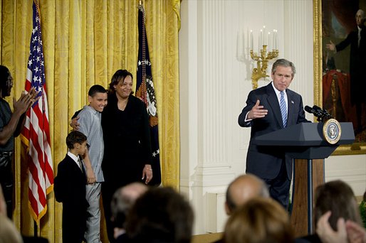 President George W. Bush addresses the audience during a program honoring graduates of welfare-to-work programs in the East Room Tuesday, Jan. 14, 2003. "In the seven years since welfare was reformed, millions of Americans have shared in this experience. Their lives and our country are better off. Today, more than 2 million fewer families are on welfare -- 2 million fewer than in 1996. It's a reduction of 54 percent," said the President. White House photo by Paul Morse.